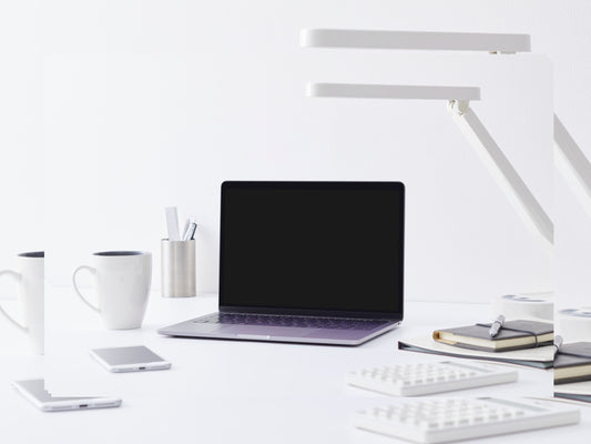 Minimal workspace with laptop, coffee, and notebook representing digital entrepreneurship in 2025